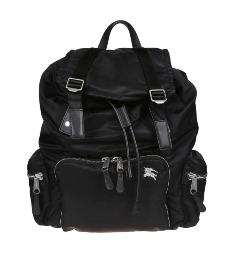 Nylon backpack featuring calf leather details, three outer zipped pockets, quilted back, snapped flap and drawstring closure, inner zipped pocket